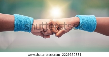 Tennis, closeup and fist bump for success, motivation and teamwork with blurred background while outdoor. Tennis player, hands and touch for respect, team building and support at training in summer