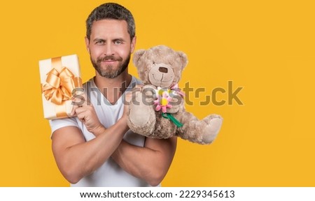 man hold valentine present in studio with copy space. man with present for valentine day.