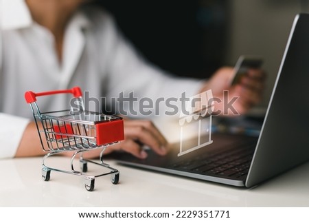 Man using laptop for shopping online on virtual screen icon with hand hold credit card. shopping cart, e-commerce, internet banking, spending money concept , purchase product sale.