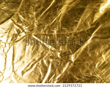 Crumpled Gold Fabric Texture Background, Wrinkled Bronze Pattern, Luxury Yellow Metallic Paper Mockup with Copy Space