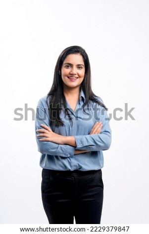 Young indian businesswoman or employee standing on white background. Royalty-Free Stock Photo #2229379847