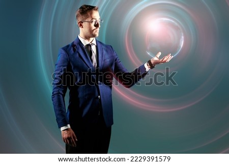 Technologies of the future. A business analyst works with a 3D-hologram in the form of a sphere. Green background.