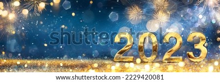 2023 New Year Celebration - Golden Number And Fireworks At Blue Eve Night In Abstract Defocused Lights Royalty-Free Stock Photo #2229420081