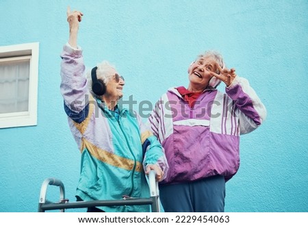 Senior, music and disability with a woman friends outdoor in a city having fun together with a peace sign hand gesture. Freedom, retirement and happy with a mature female and friend bonding outside