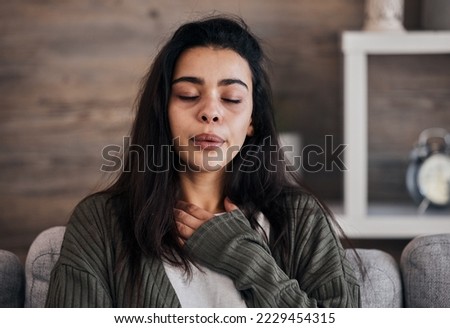 Depression, sad and woman with eyes closed in home thinking of problems. Anxiety, mental health and unhappy, depressed and lonely female on sofa in living room trying to calm down and relax in house. Royalty-Free Stock Photo #2229454315