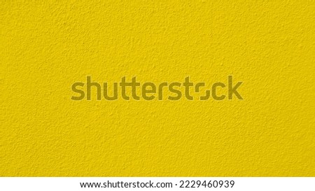 Seamless texture of yellow cement wall a rough surface, with space for text, for a background.	