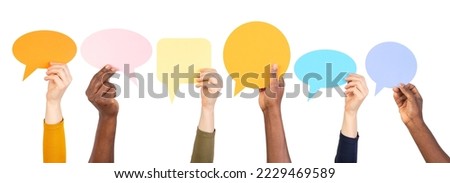 Hands holding empty speech bubbles on transparent background	 Royalty-Free Stock Photo #2229469589