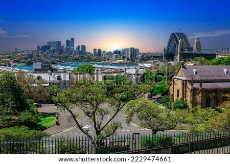 Sydney Harbour viewed from Observatory Park and overlooking Sydney Rocks area and North Sydney with colourful skies NSW Australia