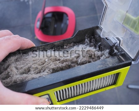 Dust container vacuum cleaner filter Royalty-Free Stock Photo #2229486449