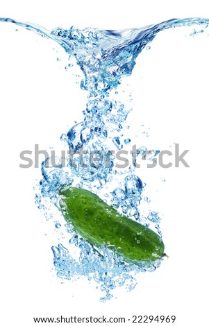 A background of bubbles forming in water after green cucumber are dropped into it.