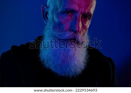 Photo of suspicious cool retired man dressed black pullover looking you xmas thief isolated dark blue color background