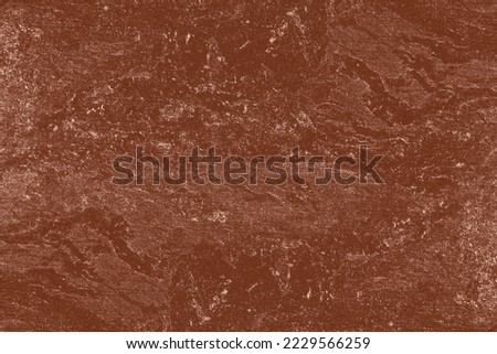 Brown marble tiles with real pale patterns. Textured background of brown marble tiles.