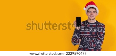 young man with christmas clothes and santa claus hat isolated