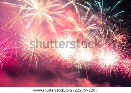 Fireworks with sparkle in long exposure shot. New year celebration concept photo. 4th July background photo.