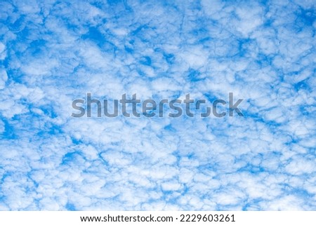 White clouds on a blue sky, beautiful natural blue background, clouds, cloudy, weather, natural phenomena.