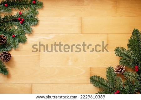 Frame of twings Christmas tree, red berries and brown cones with space for text. Christmas decoration.