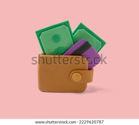 Cash and credit payment icon concept made with plasticine. Wallet with credit card and money. Online payment and money saving concept handmade with plasticine