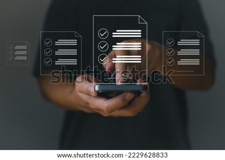 Concept of an electronic signature: business personnel sign digital documents electronically; paperless offices; future contract signing. Royalty-Free Stock Photo #2229628833