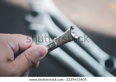 Damaged wrench, non-standard tool concept in mechanic use May cause damage to the job, durability, poor quality tools. Royalty-Free Stock Photo #2229655605