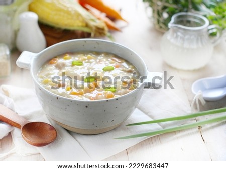 Porridge vegetable and chicken on white background Royalty-Free Stock Photo #2229683447