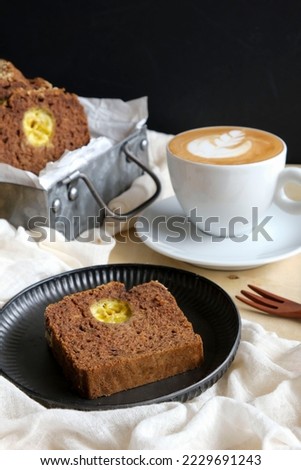 Healthy homemade pastry. Classic Chocolate Banana Bread with Latte. Made from unbleached wholemeal flour, ripen banana, rolled oats and chopped macadamia