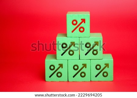 colored cube with percent icon increase percent between black decrease percent on wooden table, business development, interest increase, payment, profit concept