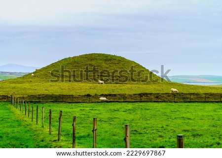View of the Maeshowe, Neolithic chambered cairn and passage grave, Mainland Orkney, Scotland, UK Royalty-Free Stock Photo #2229697867