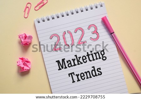 2023 Marketing trends concept in notepad on desk. 