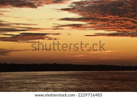 Cloud and  Sunshine during Sunrise  on Mekong River at  Khemarat   in Northeast region Thailand 

