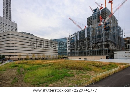 Urban development, completed and under construction buildings and vacant lots Royalty-Free Stock Photo #2229741777