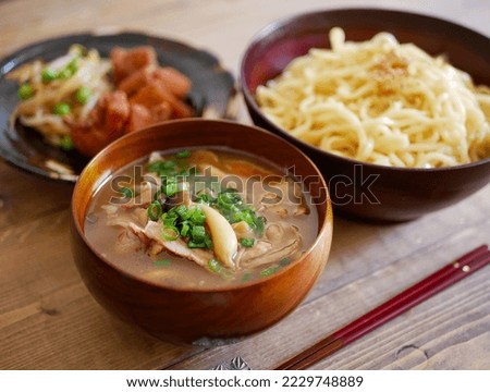 Ramen noodles dipped in pork bone soy sauce broth