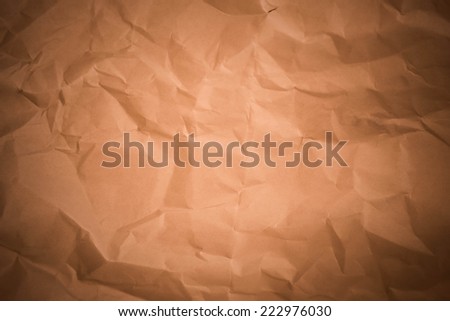 Crumpled paper background vignette