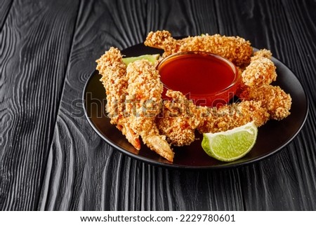 delicious crispy panko shrimp on a black wooden rustic background. Royalty-Free Stock Photo #2229780601