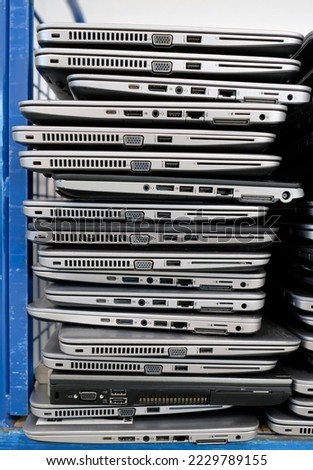 Big stacks of discarded laptops, notebooks on a trolley Royalty-Free Stock Photo #2229789155