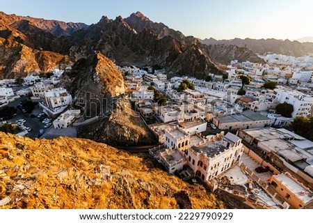 Mutrah Sunset. Cityscape View of Muscat at Beautiful Sunset. The Capital of Oman. Arabian Peninsula. Royalty-Free Stock Photo #2229790929