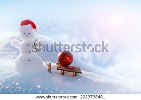 Christmas background with happy snowman and wood sled, stand in white snow.