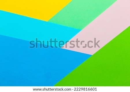 Multicolored geometric background from paper cardboard abstraction.