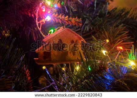 Closeup of Christmas tree decorations . Lights on Christmas tree. Christmas and New Year decorations on Xmas tree. Xmas tree with decorations. Vintage Christmas decoration.