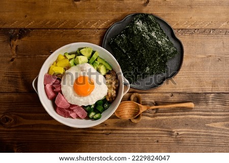 Healthy Japanese food with sashimi, pickles, vegetables, natto (fermented soybeans), etc.