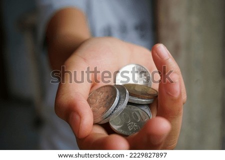 Stock photo of someone who is making a monetary donation
