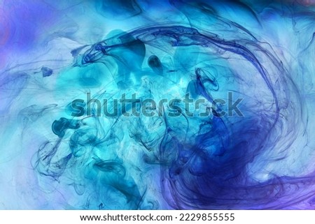 Blue ink abstract background. Acrylic paint backdrop for perfume, hookah, cosmetics. Mysterious smoke clouds, colorful fog