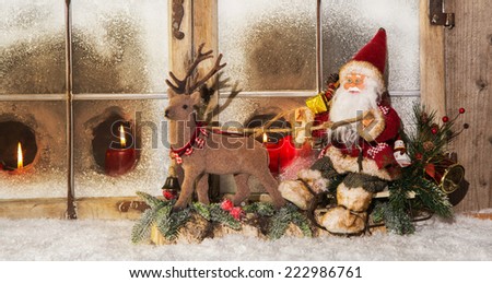 Classical christmas decoration: santa claus riding on reindeer buying gifts.