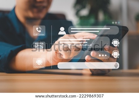 Person use customer service and support live chat with chatbot and automatic messages, Artificial intelligence, and CRM software technology. AI Chatbot smart digital customer service application. Royalty-Free Stock Photo #2229869307