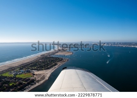 Aerial view from a plane of Silver Strand Beach in San Diego California with boats in the water