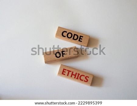 Code of ethics symbol. Concept words Code of ethics on wooden blocks. Beautiful white background. Business and Code of ethics concept. Copy space.