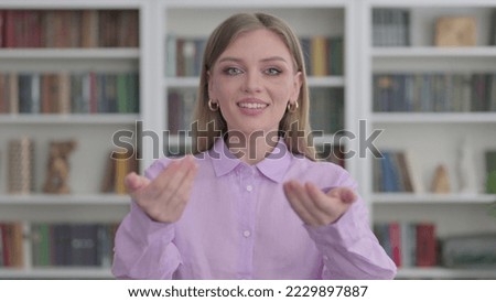Portrait of Woman Pointing at the Camera and Inviting