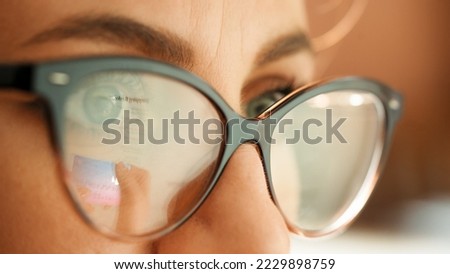 Reflection in glasses of the hands and credit card making e bank online payment. Ecommerce website payments concept.