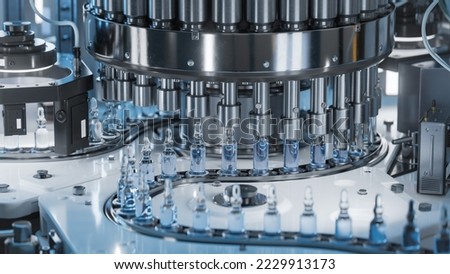 Medical Ampoule Production Line at Modern Modern Pharmaceutical Factory. Glass Ampoules are being Filled. Medication Manufacturing Process. Royalty-Free Stock Photo #2229913173