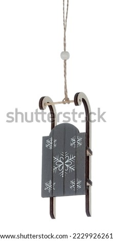 Christmas gadget to hang on the Christmas tree with figures of Santa Claus, nativity scene, sleigh