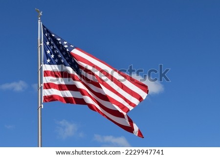 USA flag on blue sky background